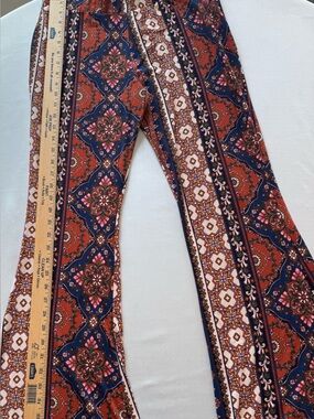 Altar’d State Boho Floral Print Flared Pants in Rust & Navy